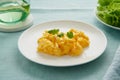 Scrambled eggs, omelette. Breakfast with pan-fried eggs. Texture of omelet on white plate Royalty Free Stock Photo