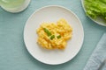 Scrambled eggs, omelette. Breakfast with pan-fried eggs. Texture of omelet on white plate Royalty Free Stock Photo