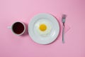 Scrambled eggs on a pink background. Fried eggs on a white plate. Royalty Free Stock Photo