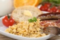 Scrambled eggs, sausages and vegetables for breakfast Royalty Free Stock Photo