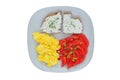 Scrambled eggs with soft cheese and tomatos in a plate isolated on a white background. Homemade breakfast. Top view. Royalty Free Stock Photo