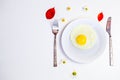 Scrambled eggs on a white plate and a bright white table Royalty Free Stock Photo