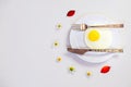 Scrambled eggs on a white plate and a bright white table Royalty Free Stock Photo