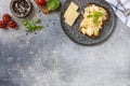 Scrambled eggs on whole grain bread on a stone table. Homemade breakfast or brunch meal - scrambled eggs. View from above. Copy Royalty Free Stock Photo