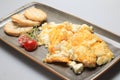 Scrambled eggs wioth some bread and cherry tomatoes Royalty Free Stock Photo