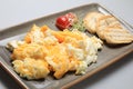 Scrambled eggs wioth some bread and cherry tomatoes Royalty Free Stock Photo