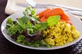 Scrambled tofu with salad leaves for breakfast