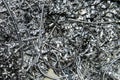 Scrap Closeup twisted spiral steel shavings twisted metal from lathe machine In industrial plants