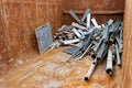 Scrap metal container filled with discarded iron pieces Royalty Free Stock Photo