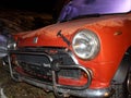 scrap of a red mini vintage model car