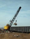 Scrap yard crane with magnet Royalty Free Stock Photo