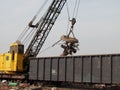 Scrap yard crane with magnet Royalty Free Stock Photo