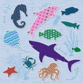 Scrapbook elements. Fish with patterns on blue background.