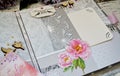 Scrapbooking handmade photo album. Diy. Top view on table with elements for scrapbooking, cut paper, die cuts, paper flowers,