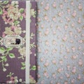 Scrapbooking holder for travel documents on floral paper Royalty Free Stock Photo