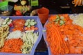 Scraped variety of vegetables on a plastic tray