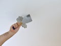 Scraping a Ceiling with a Spatula Royalty Free Stock Photo