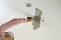 Scraping a Ceiling with a Tool Royalty Free Stock Photo