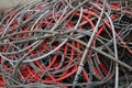 Scrapped electrical cables in electrical discharge