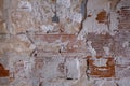 Scraps of plaster coating on old brick wall Royalty Free Stock Photo