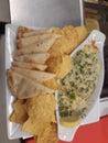 Scratch made spinach and artichoke dip with grilled naan bread and freshly made tortilla chips