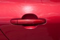 Scratch on red car door handle Royalty Free Stock Photo