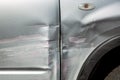 Scratched car door and fender after an accident. Royalty Free Stock Photo