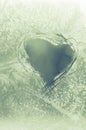 Scratched heart on frosty window Royalty Free Stock Photo