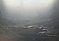 Scratched metallic surface with various deep gouges and irregular scratches, reflecting light. The Royalty Free Stock Photo
