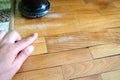 Scratched old parquet flooring needs maintenance. The parquet is damaged by scratches from prolonged use. Master's Royalty Free Stock Photo