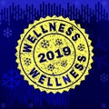 Scratched WELLNESS Stamp Seal on Winter Background