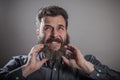 Scratching huge beard portrait, mature adult Caucasian man Royalty Free Stock Photo