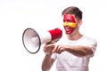 Scream on megaphone Spain football fan in game supporting of Spain Royalty Free Stock Photo