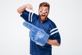 Screaming excited man fan in blue t-shirt standing isolated Royalty Free Stock Photo