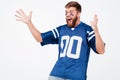 Screaming excited man fan in blue t-shirt standing isolated Royalty Free Stock Photo