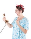 Screaming funny housewife with old telephone Royalty Free Stock Photo