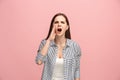 The young emotional angry woman screaming on pink studio background Royalty Free Stock Photo