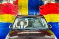 Screaming kid in car at carwash Royalty Free Stock Photo