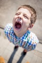 Screaming kid with caries and a missing tooth