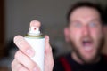 Screaming man in the background out of focus foreground aerosol can gas from insects Royalty Free Stock Photo