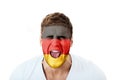 Screaming man with Germany flag on face. Royalty Free Stock Photo
