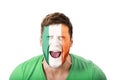 Screaming man with Ireland flag on face. Royalty Free Stock Photo