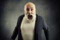 Screaming senior man with beard over dark wall Royalty Free Stock Photo