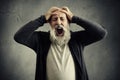 Screaming senior man with closed eyes Royalty Free Stock Photo