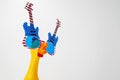 Screaming toy chicken in glasses on a white background. Toy yellow shrilling chicken on white background. Copyspace Royalty Free Stock Photo