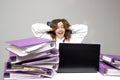 Screaming woman at desk with laptop and folders. Female entrepreneur suffers from nervous breakdown caused by fatigue, too much Royalty Free Stock Photo