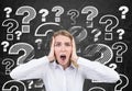 Screaming woman and question marks Royalty Free Stock Photo