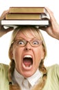 Screaming Woman Under Stack of Books on Head Royalty Free Stock Photo