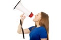 Screaming young woman with megaphone. Royalty Free Stock Photo