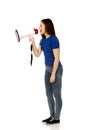 Screaming young woman with megaphone. Royalty Free Stock Photo